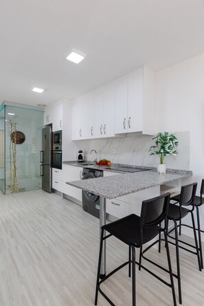 Microwave, dishwasher, coffee/tea maker, cookware/dishes/utensils