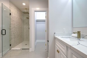 Shower, hair dryer, towels, shampoo