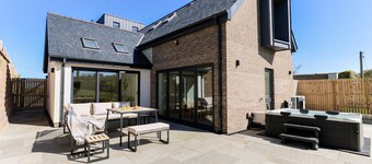 A modern costal dormer bungalow in the scenic Bull Bay, offering stunning coastal views for up to 7 guests
