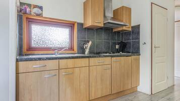 Fridge, stovetop, dishwasher, coffee/tea maker