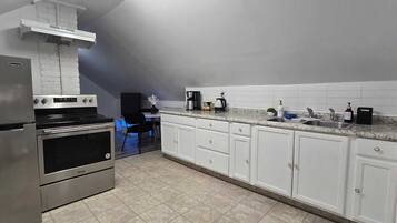 Fridge, coffee/tea maker, toaster, cookware/dishes/utensils