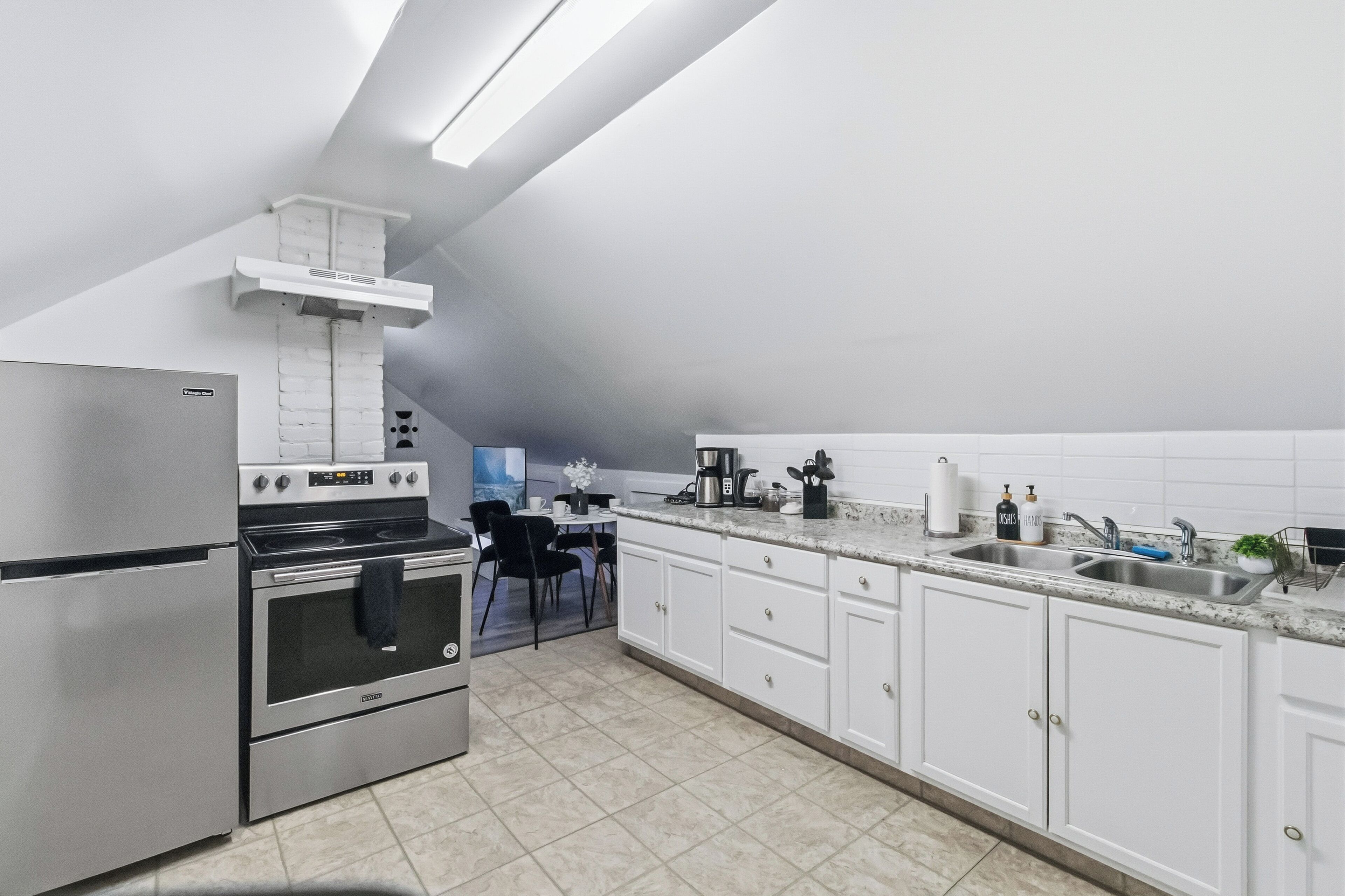 Fridge, coffee/tea maker, toaster, cookware/dishes/utensils