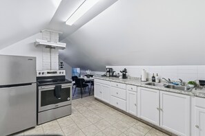 Fridge, coffee/tea maker, toaster, cookware/dishes/utensils