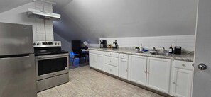 Fridge, coffee/tea maker, toaster, cookware/dishes/utensils