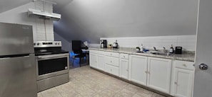 Fridge, coffee/tea maker, toaster, cookware/dishes/utensils