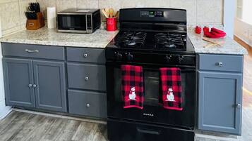 Fridge, coffee/tea maker, toaster, cookware/dishes/utensils