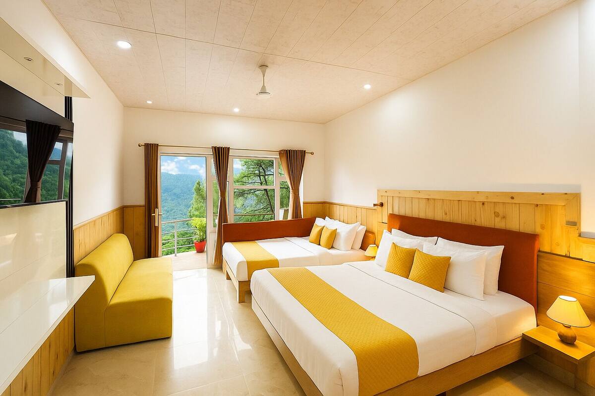 A hotel room with two beds, a sofa, a TV, and a balcony with a view of the mountains.