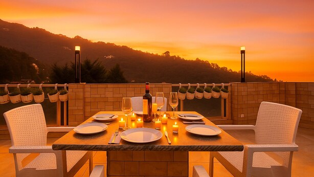 A sunset view from a terrace with a table set for two, surrounded by wicker chairs and candlelight. - Hotel Shiva Lake - Near Mussoorie Lake (Mussoorie)