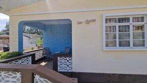 A building with a blue wall and a window. - Family-friendly home from home located close to beach, bars and restaurants (Bridgetown)