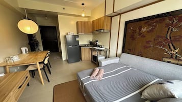 Desk, laptop workspace, blackout drapes, bed sheets