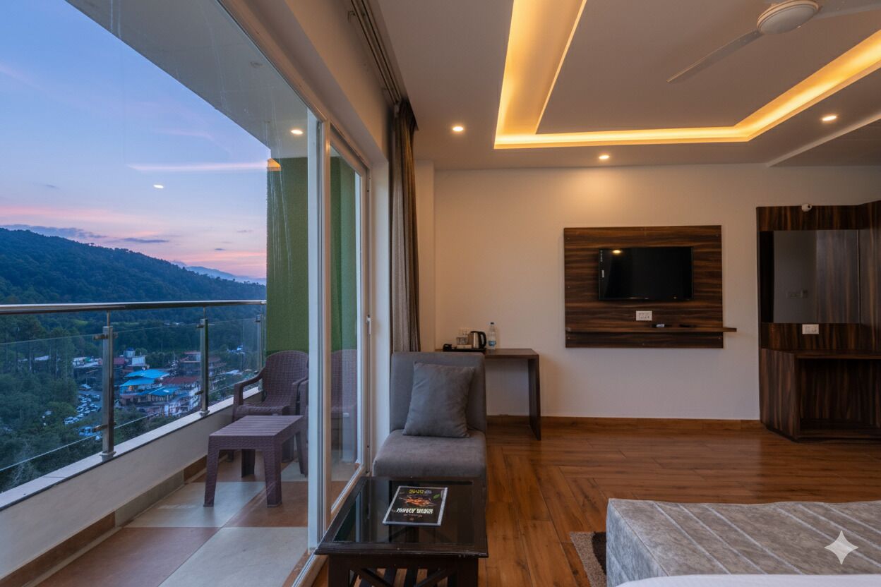 A modern room with a balcony, a sofa, a coffee table, a TV mounted on the wall, and a wooden cabinet.