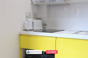 Fridge, microwave, stovetop, cookware/dishes/utensils