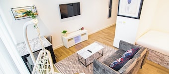 Stylish Central Studio With Hanging Chair – APT 2