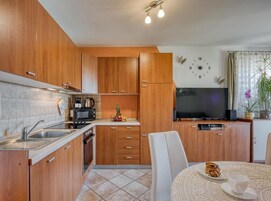 Apartment (One Bedroom Apartment with Balcony) | Private kitchen | Fridge