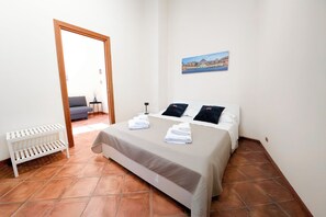 Family Room, Garden View | Desk, laptop workspace, blackout drapes, iron/ironing board - Il Cantico Home (Naples)