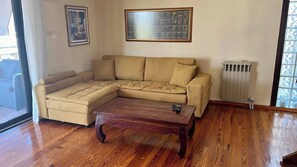 Apartment, 1 Bedroom, Balcony | Living room | Books - Charming 2-level Apartment in Voula With Sea & Mountain Views (Athens)