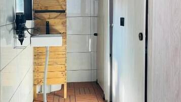 Shower, hair dryer, slippers, shampoo