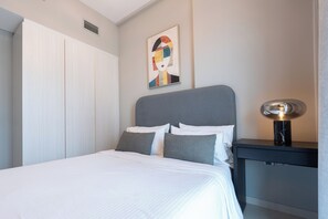 Deluxe Apartment | Premium bedding, in-room safe, blackout drapes, iron/ironing board