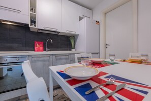 Fridge, oven, electric kettle, cookware/dishes/utensils