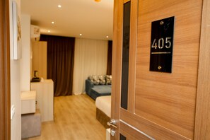 Deluxe Triple Room, City View | In-room safe, blackout drapes, soundproofing, iron/ironing board - Sultan Pyramids View INN (Giza)