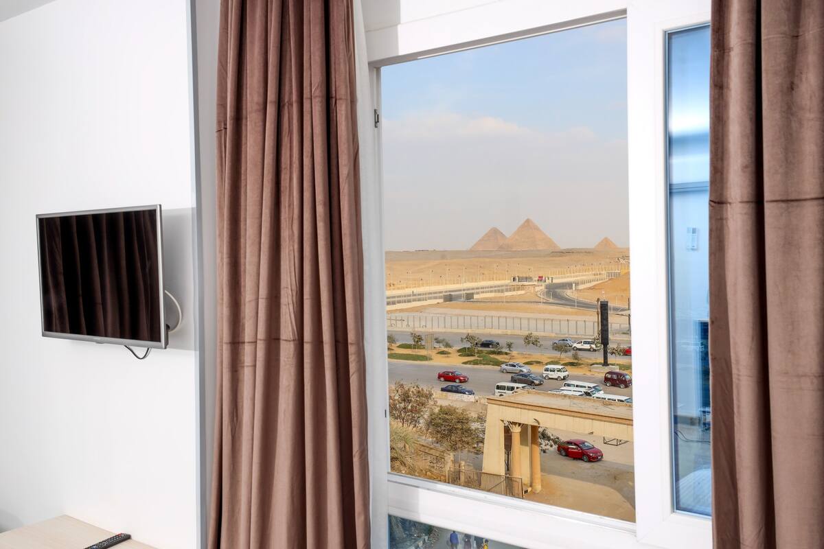 Deluxe Triple Room, City View | In-room safe, blackout drapes, soundproofing, iron/ironing board