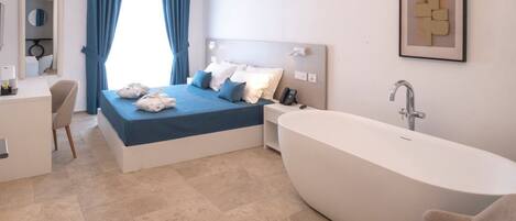 Deluxe Room, City View | Minibar, in-room safe, desk, laptop workspace