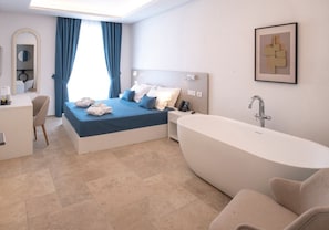 Deluxe Room, City View | Minibar, in-room safe, desk, laptop workspace