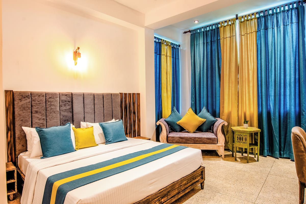 Deluxe Double Room, Garden View | In-room safe, desk, blackout curtains, iron/ironing board