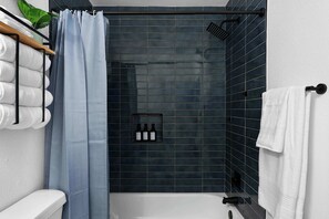 Shower, hair dryer, towels, shampoo