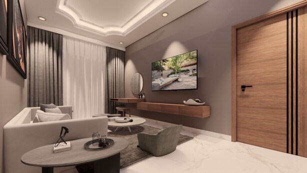 A modern living room with a sofa, coffee table, and TV. There is a wooden door and a wall-mounted TV. - Utkal Hotels Bhubaneswar (Bhubaneshwar)