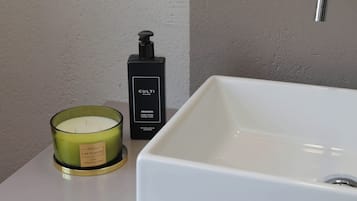 Designer toiletries, hair dryer, bidet, towels