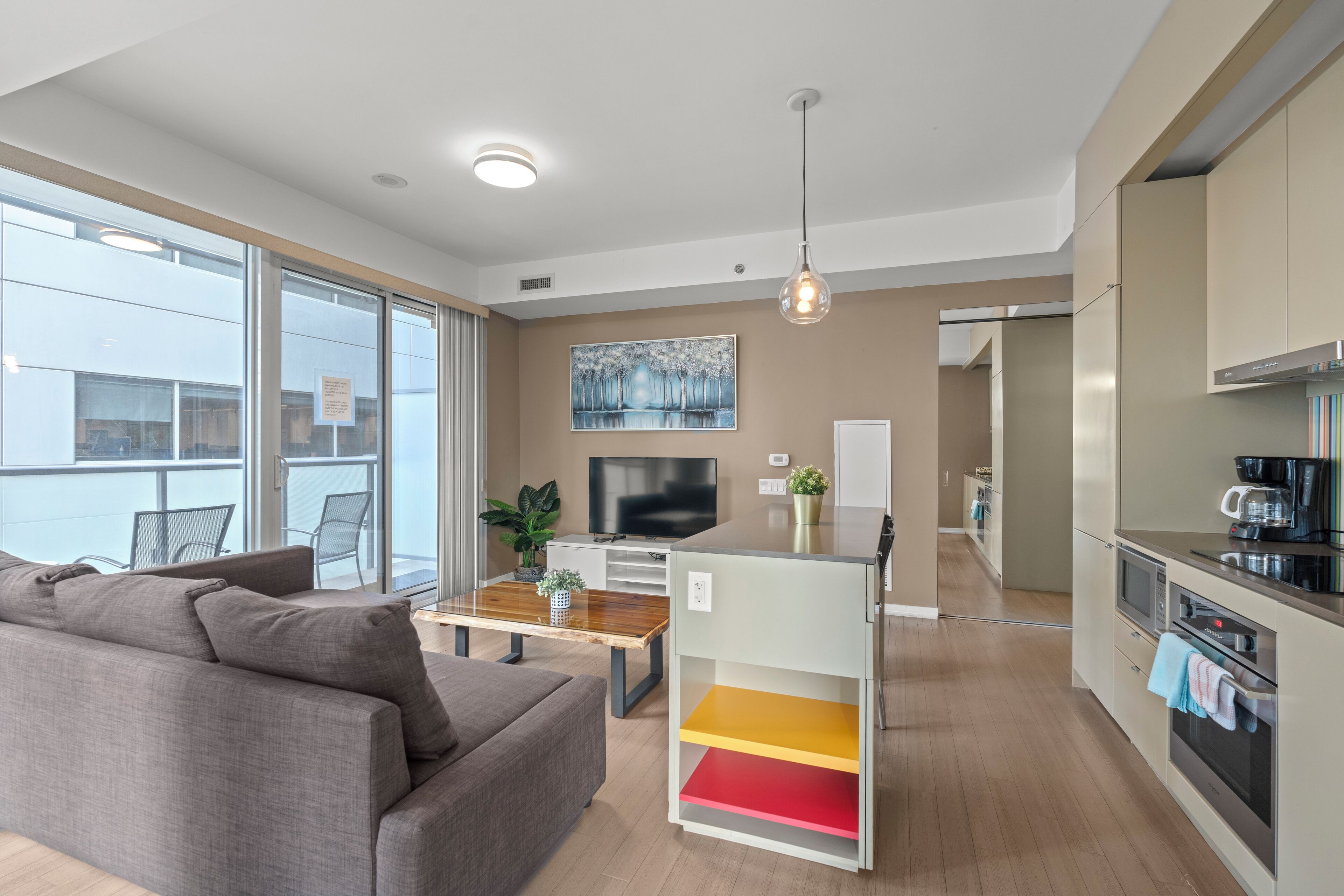 Deluxe Apartment | Living area | 55-inch LED TV with cable channels