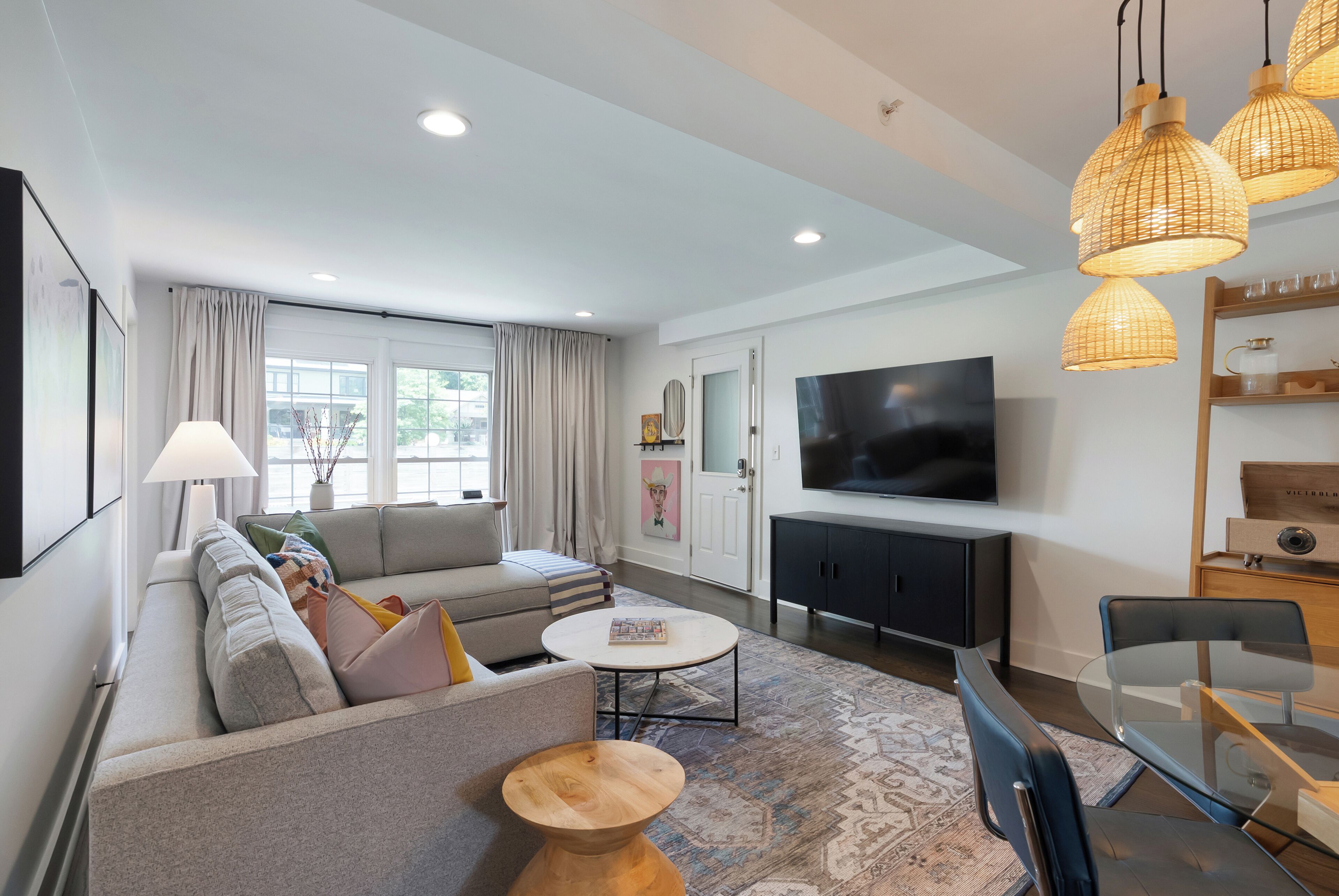 A modern living room with a sofa, coffee table, and TV.