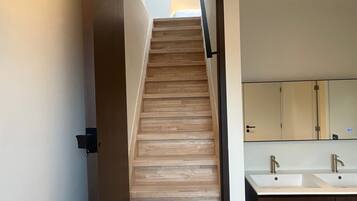 Family Room, 2 Bedrooms, Balcony | Bathroom | Shower, rainfall showerhead, hair dryer, heated floors