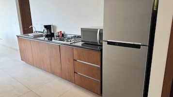 Family Apartment, Garden View | Private kitchen | Fridge, microwave, espresso maker, cookware/dishes/utensils