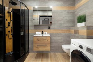 Shower, hair dryer, towels, shampoo