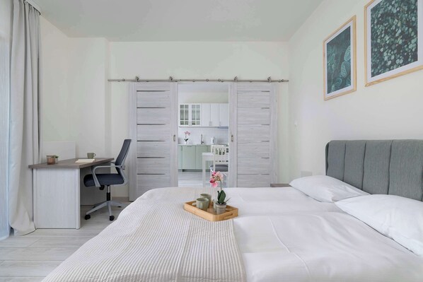 1 bedroom, desk, iron/ironing board, travel crib