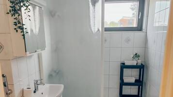 Shower, hair dryer, bathrobes, towels