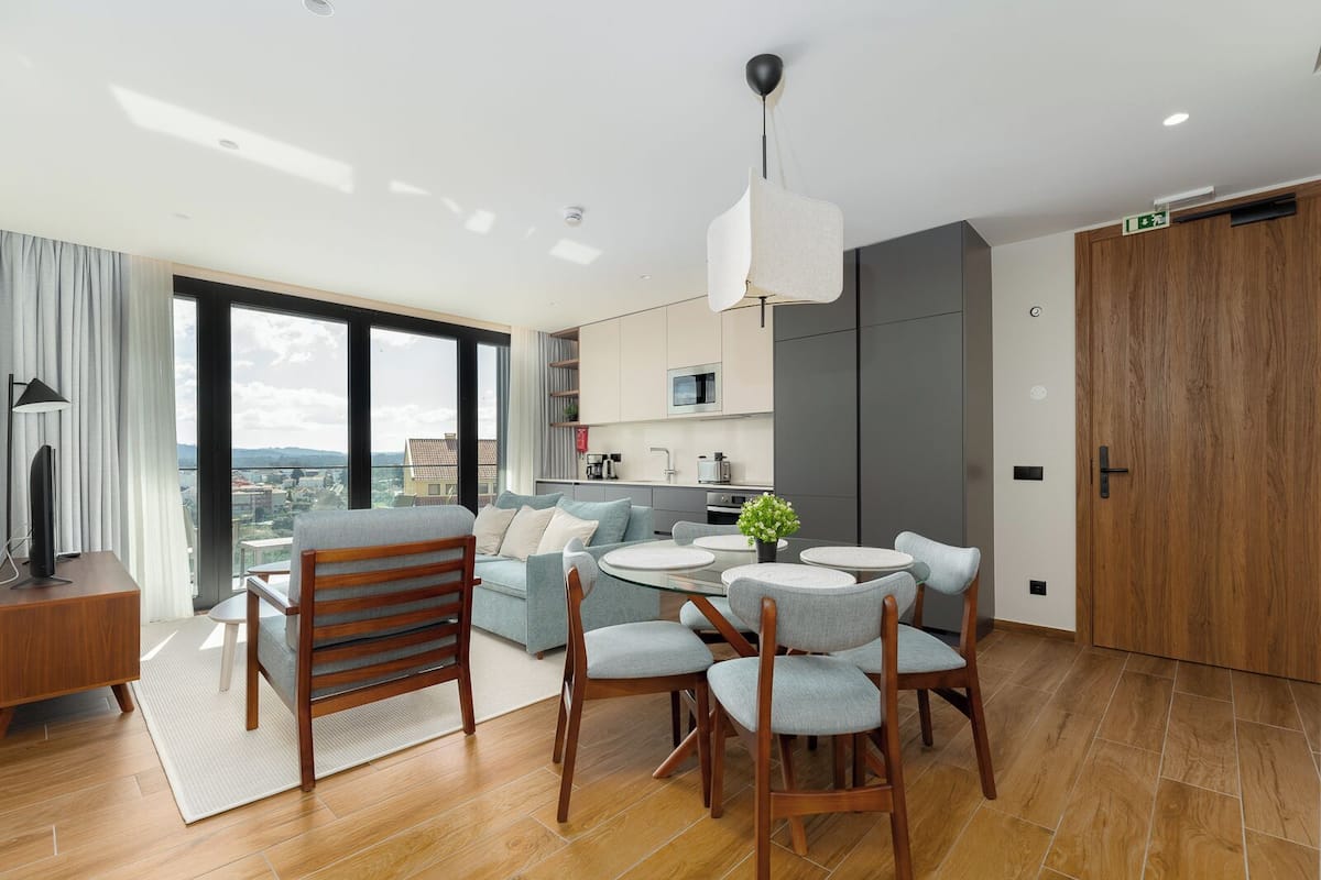 Deluxe Apartment | Living area | 80-cm LED TV with cable channels