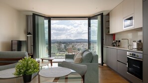 Deluxe Apartment | Living area | 80-cm LED TV with cable channels