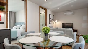 Superior Apartment | Living area | 80-cm LED TV with cable channels