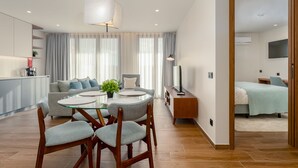 Deluxe Apartment, City View | Living area | 80-cm LED TV with cable channels