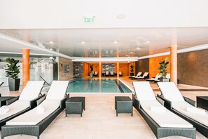 Indoor pool, seasonal outdoor pool, pool umbrellas, pool loungers