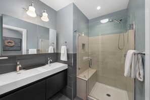 Shower, hair dryer, towels, shampoo
