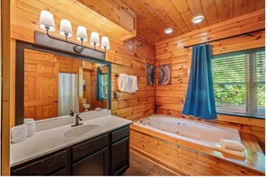 Jetted tub, hair dryer, towels, soap