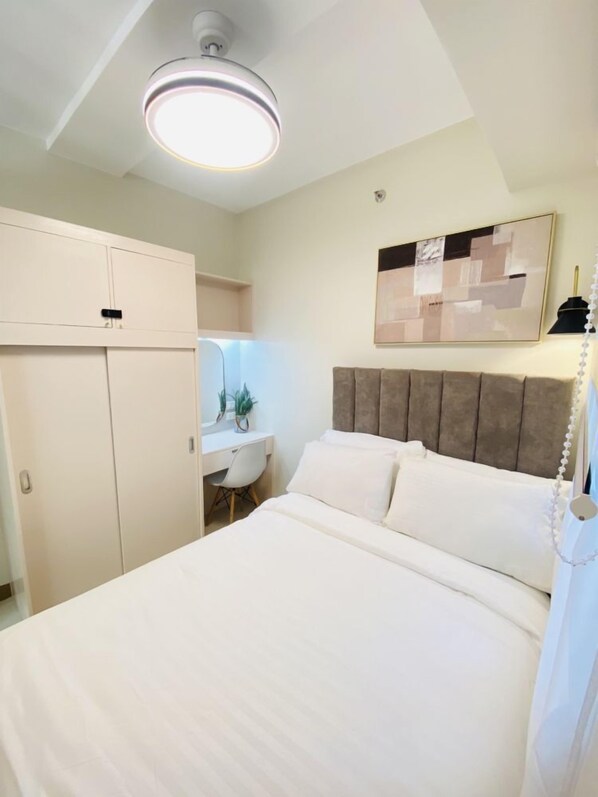 Fer et planche à repasser, draps fournis