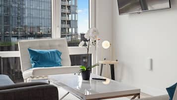 Suíte empresarial, vista para a cidade | Área de estar