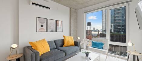 Business suite, uitzicht op de stad | Woonruimte