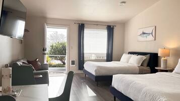 Tabla de planchar con plancha, wifi y ropa de cama