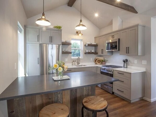 Fridge, microwave, stovetop, cookware/dishes/utensils